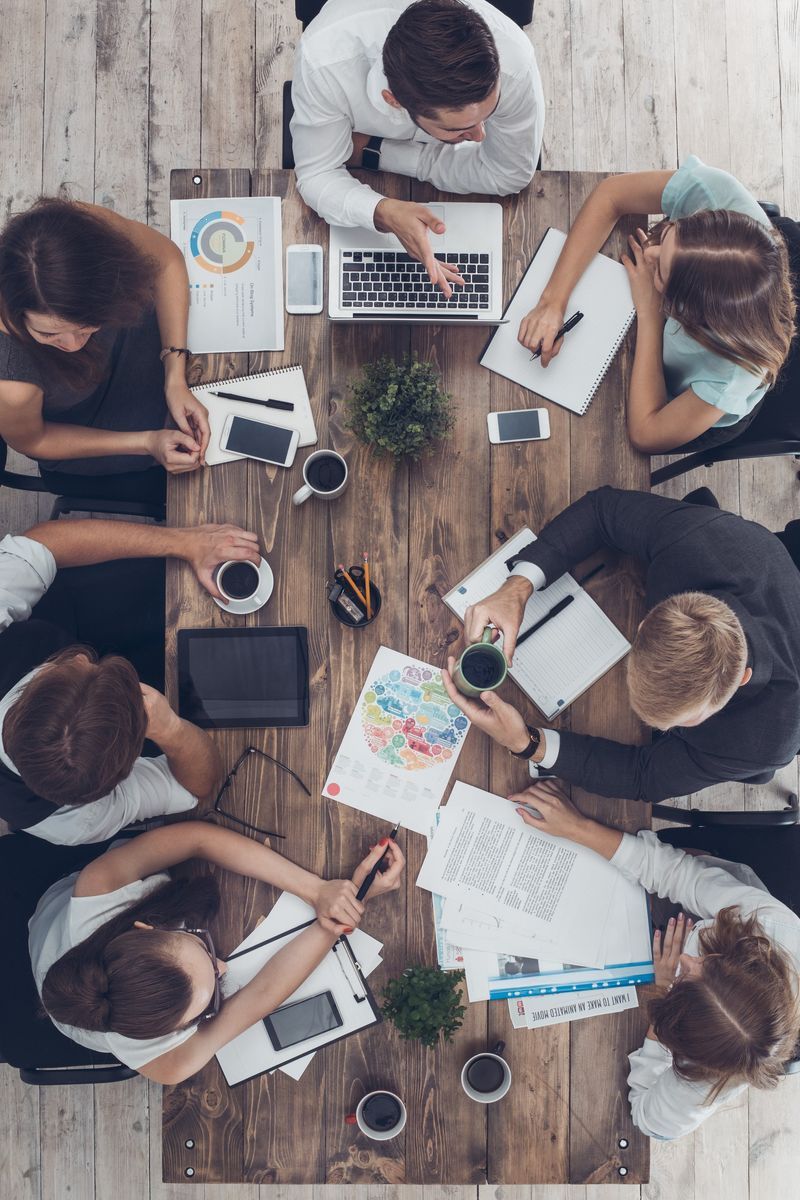 A Go Advisors team working together around a table